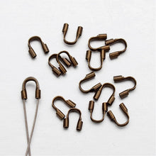 Load image into Gallery viewer, Packet of 150+ Antique Bronze Plated Brass 5 x 6mm Wire Guardians